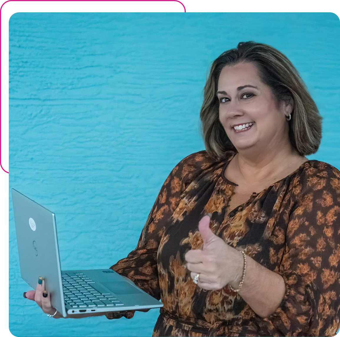 A woman holding an open laptop and giving the thumbs up.